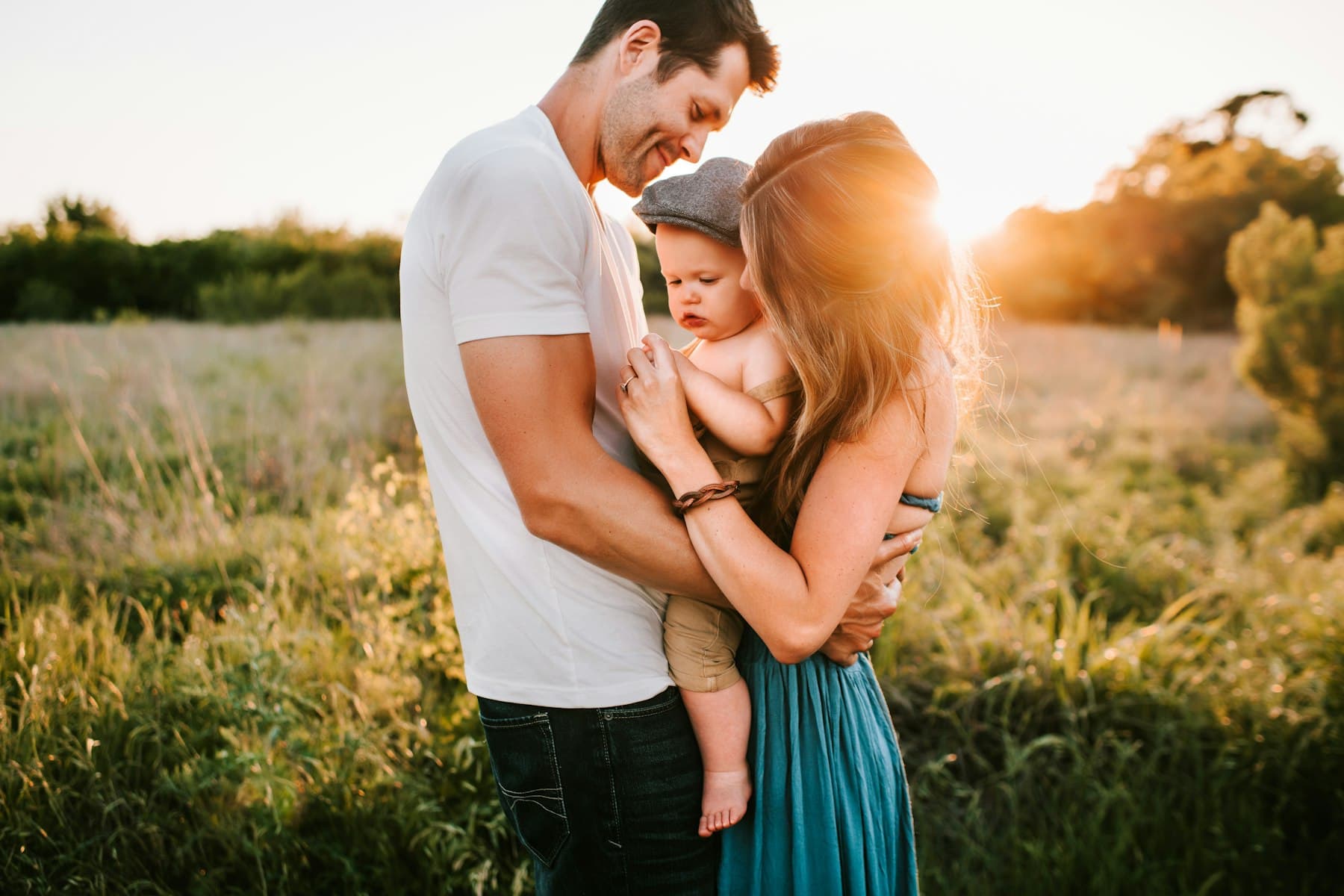 Family on grass during golden hour