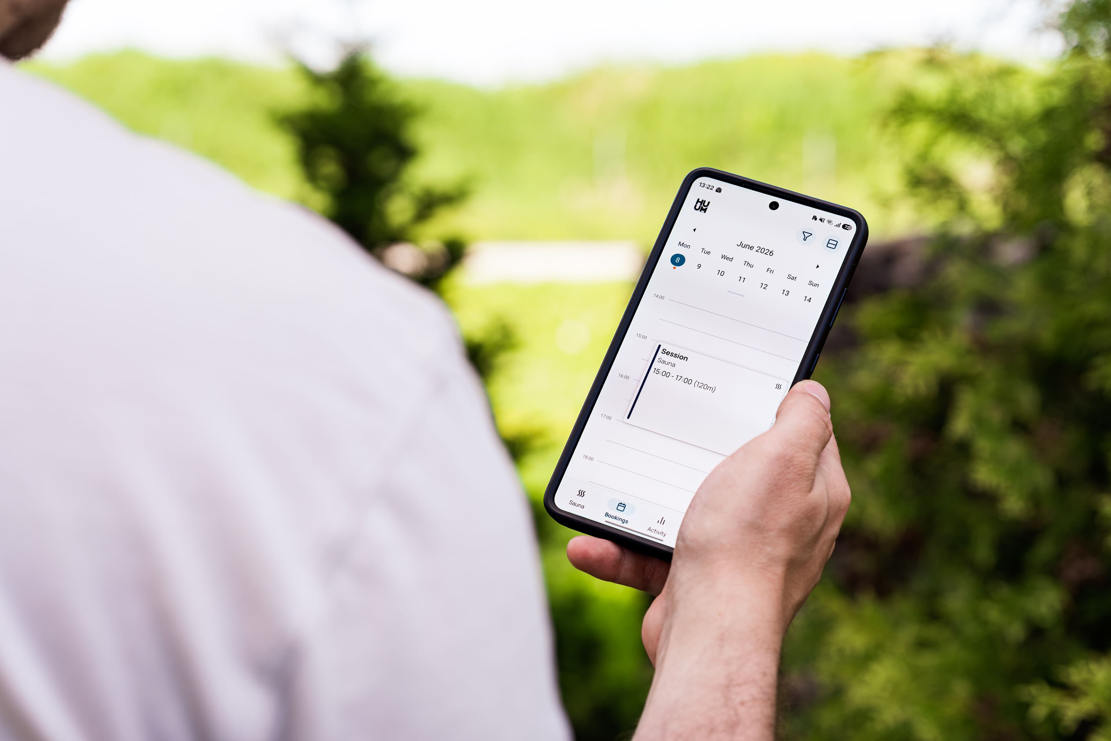 Person reviewing an appointment schedule on a mobile phone outdoors